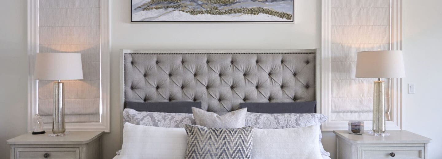 a luxury home with a grey luxury primary bedroom