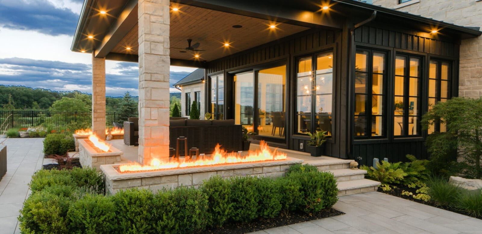 An inviting rear view of a backyard, blending stunning hardscaping with lush landscaping for a perfect outdoor space.