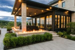 An inviting rear view of a backyard, blending stunning hardscaping with lush landscaping for a perfect outdoor space.