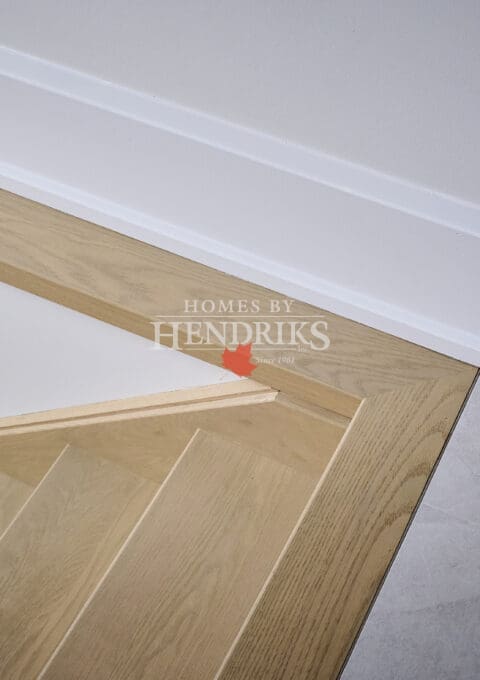 Close-up of the staircase showing refined railing craftsmanship and clean detailing.