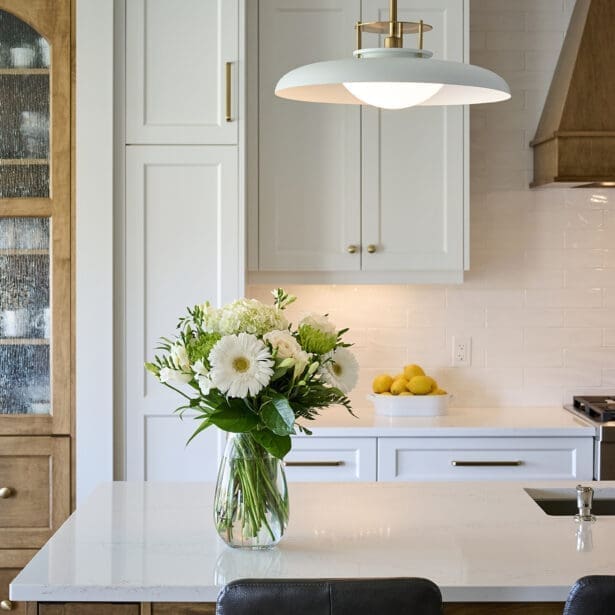 Custom two-tone maple cabinetry in the kitchen, featuring a rich blend of natural wood tones