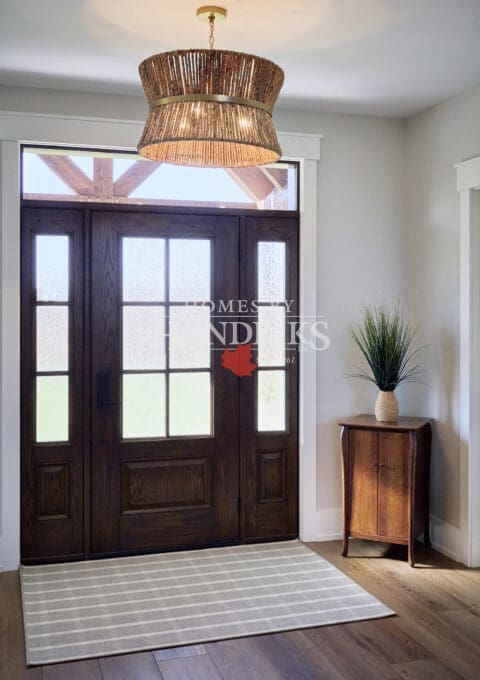 A custom wooden front door with rich, textured wood grain, showcasing intricate detailing and a warm, inviting design.