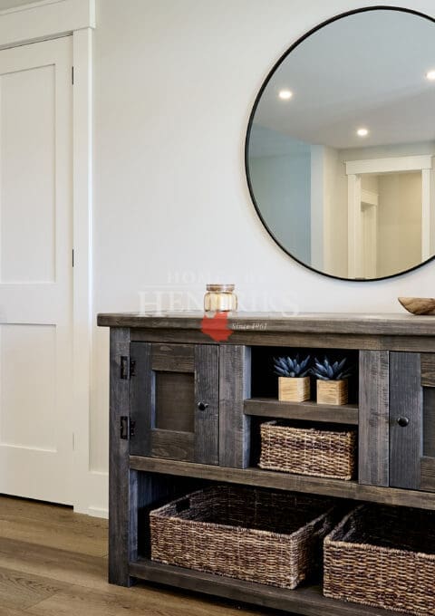 A charming entryway hutch featuring custom cabinetry with a mix of wood tones, offering both style and functionality.