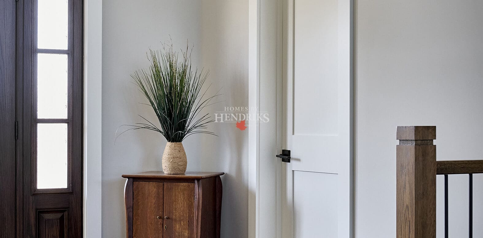 A welcoming entryway featuring a spacious, open design with rustic timber framing and elegant finishes.