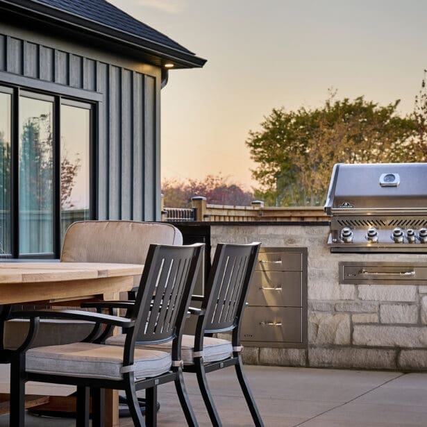 A well-designed outdoor BBQ area featuring a built-in grill and spacious countertop, perfect for cooking and entertaining.