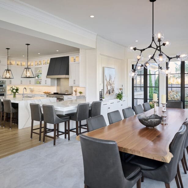 Open view from the dining room into the kitchen, highlighting the island, cabinetry, and seamless layout.
