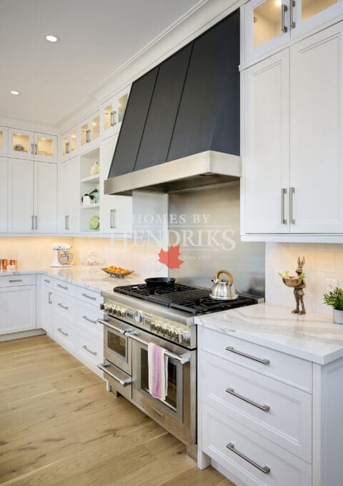 Modern chef’s kitchen with a large island, premium appliances, and custom cabinetry