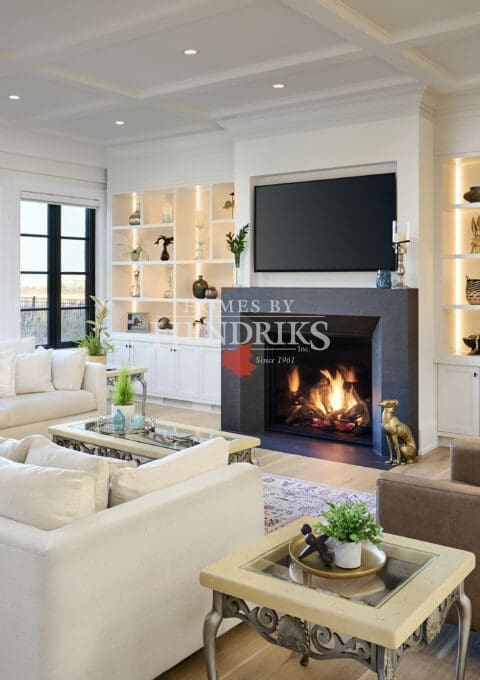 Contemporary solid-surface fireplace featuring a horizontal gas insert and clean, minimalist detailing.