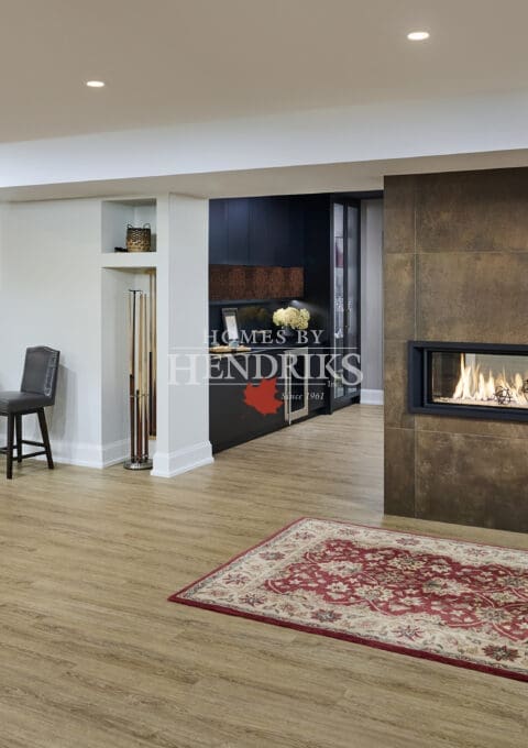 Comfortable basement lounge with soft seating and layered lighting.