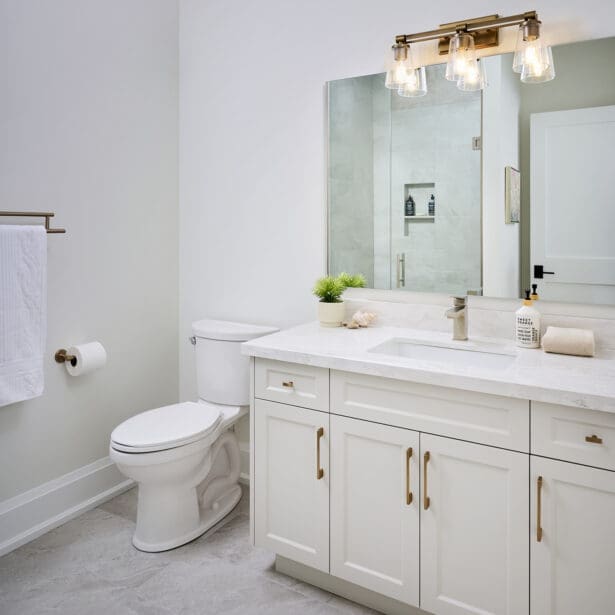 Shared bathroom with double sinks and durable, family-friendly finishes.