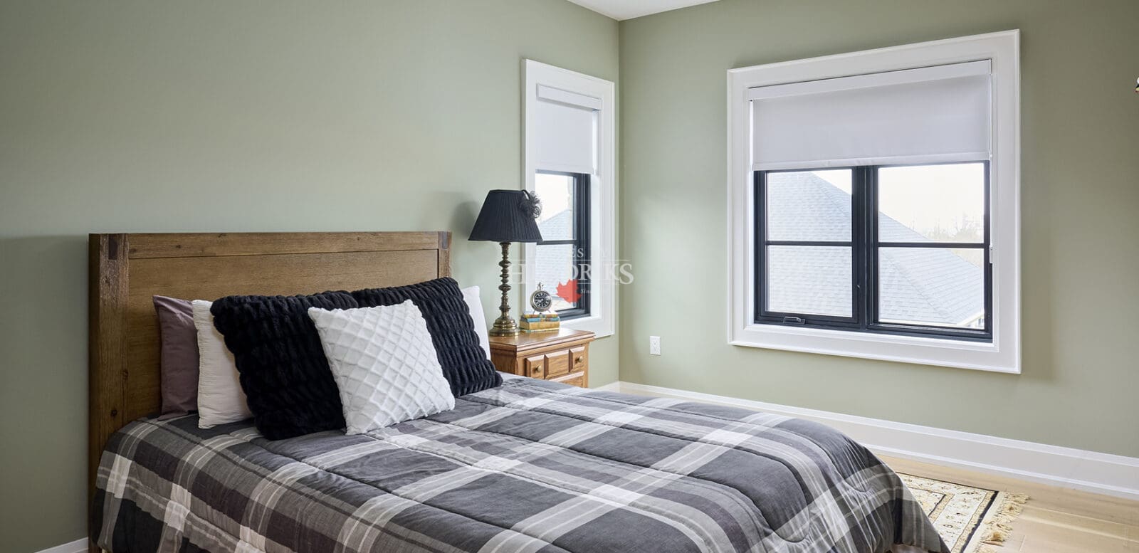 Guest bedroom with neutral tones and soft natural lighting.