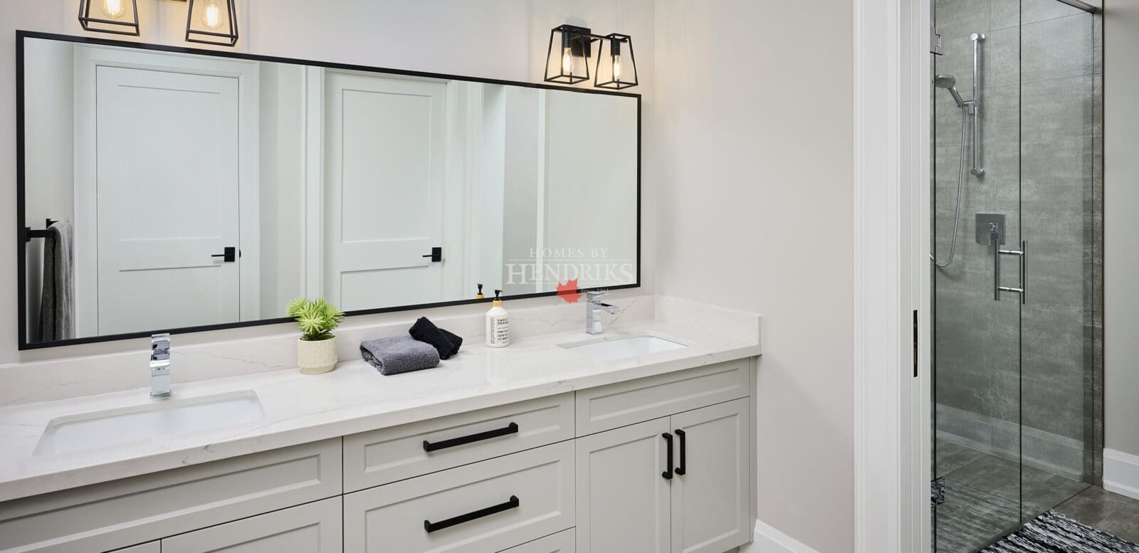 Guest bathroom with modern fixtures, a tiled shower, and clean finishes.