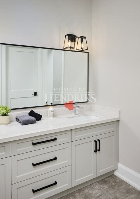 Guest bathroom with modern fixtures, a tiled shower, and clean finishes.