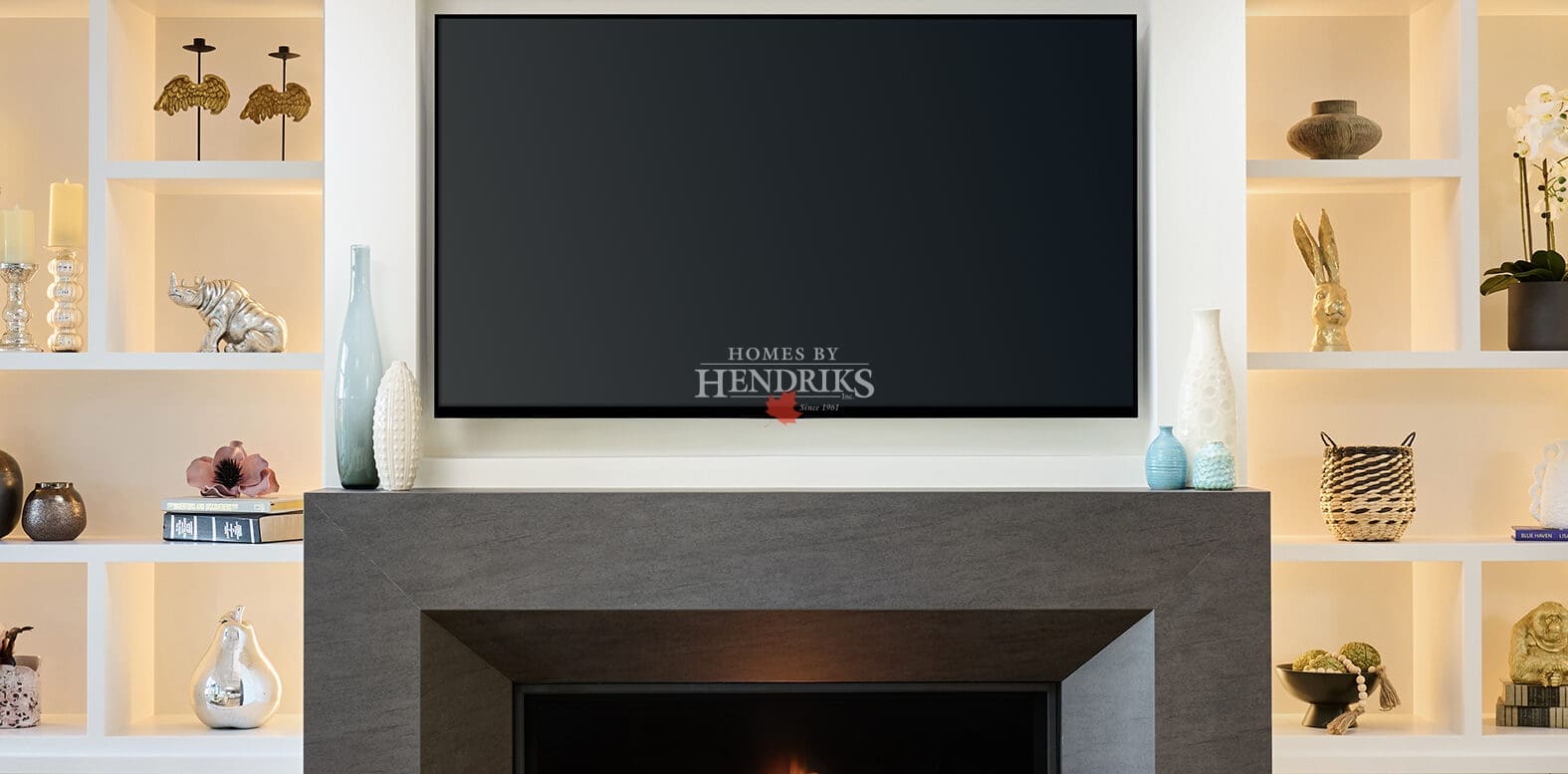 Freestanding solid-surface fireplace with a sleek linear gas insert, warm tonal cladding, and a modern minimalist design.