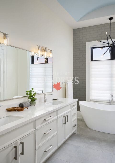 Luxury ensuite with a freestanding tub, walk-in shower, and double vanity.