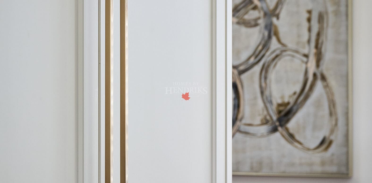 Bright kitchen corner with shaker cabinets and gold hardware