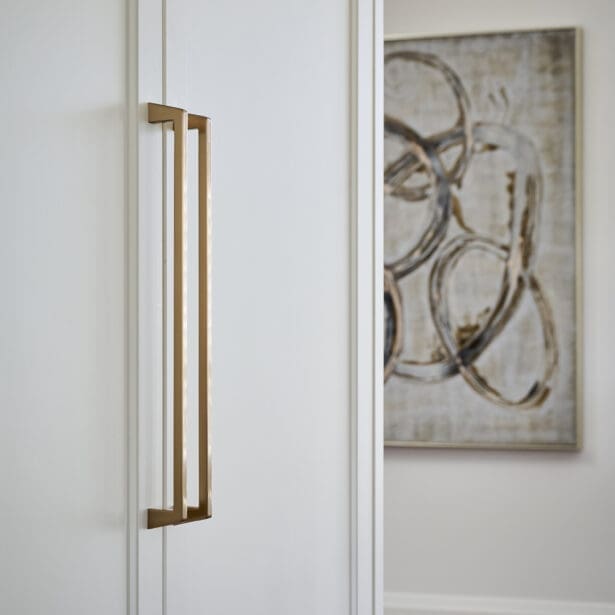 Bright kitchen corner with shaker cabinets and gold hardware