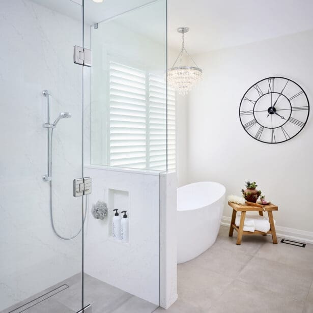 Clean, minimalist shower design with frameless glass enclosure, chrome hardware, and linear drain for a sleek contemporary finish.