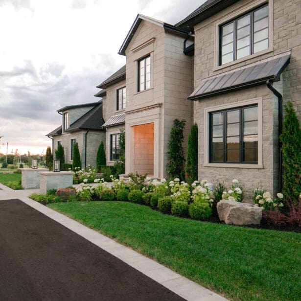 An attractive glimpse of the front doorway of a tailored custom residence, exterior view